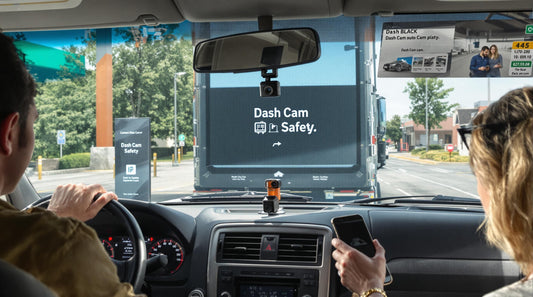 Truck driver and commuter with dash cams at service station, safety emphasized